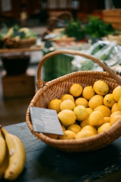 A bowl of fruit sitting on a table Description automatically generated